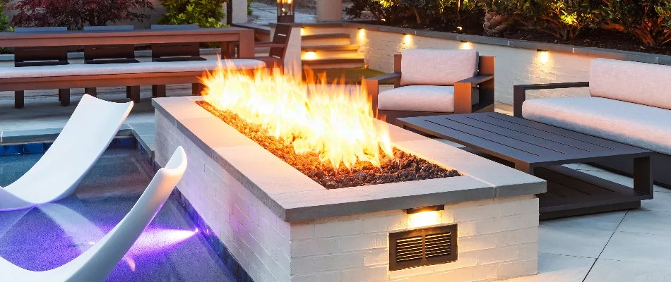 Chairs around a gas fire pit in Cary, NC.
