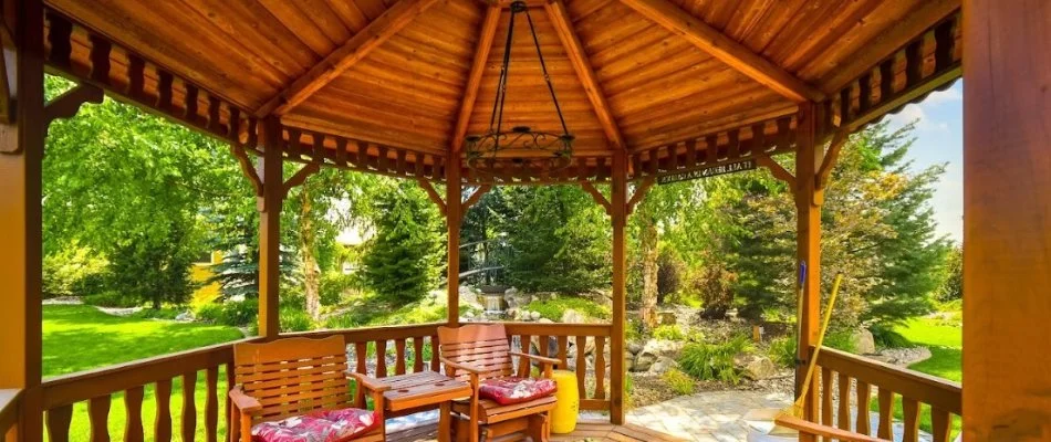 Furniture inside a wooden gazebo in Cary, NC.